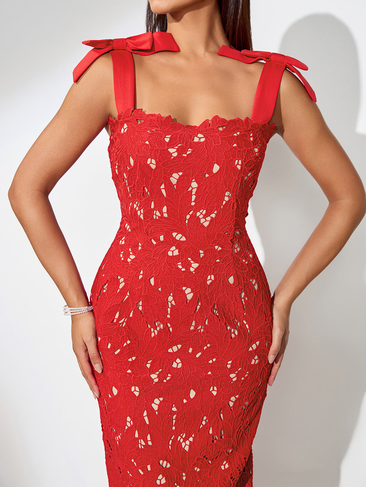 Embroidered floral dress with thin straps and cut-out details for an elegant look