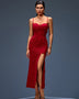 Long flowing dress with a plunging neckline, floral appliqués, and a dramatically high slit