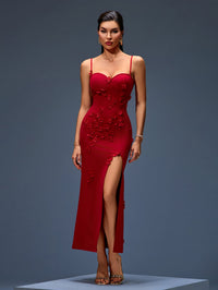 Desirée Montclair — Long flowing dress with a plunging neckline, floral appliqués, and a dramatically high…