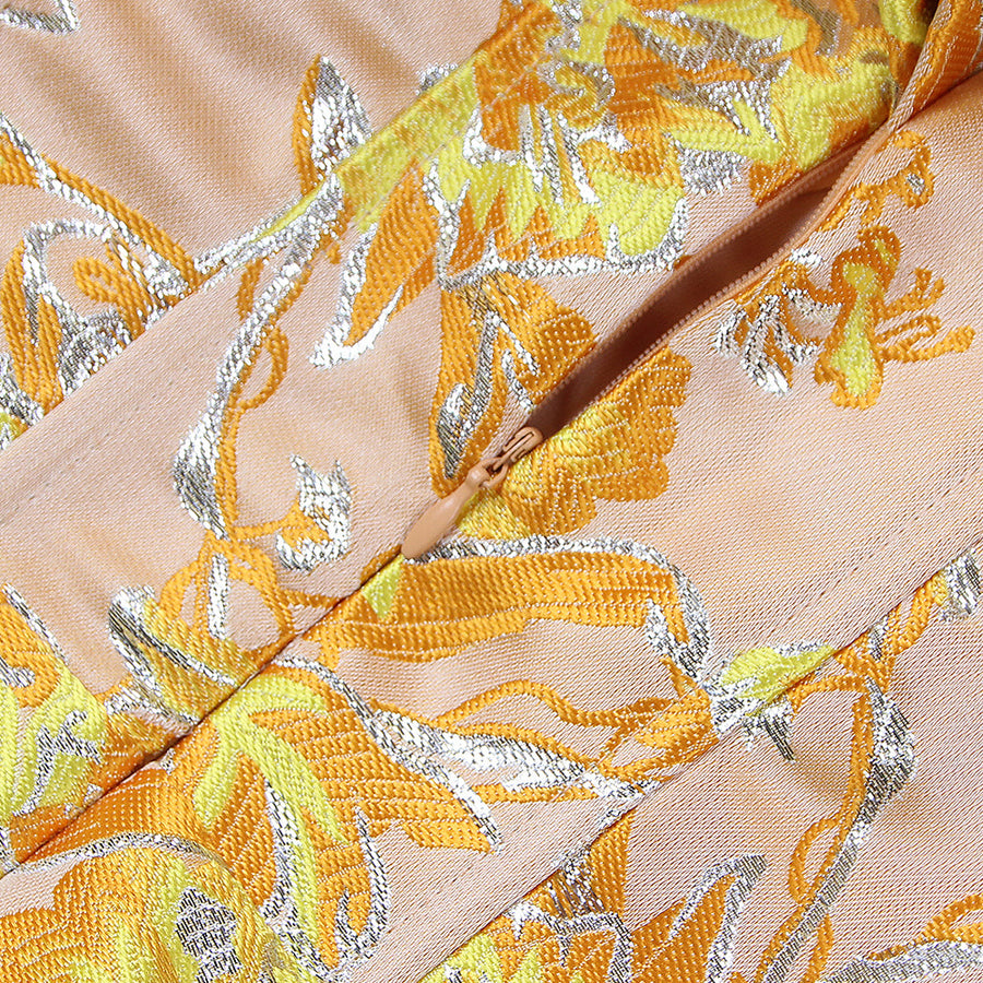 Short fitted pleated strapless dress with backless design for a chic and elegant look