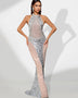 Elegant open-decolleté dress adorned with sparkling jewelry chain