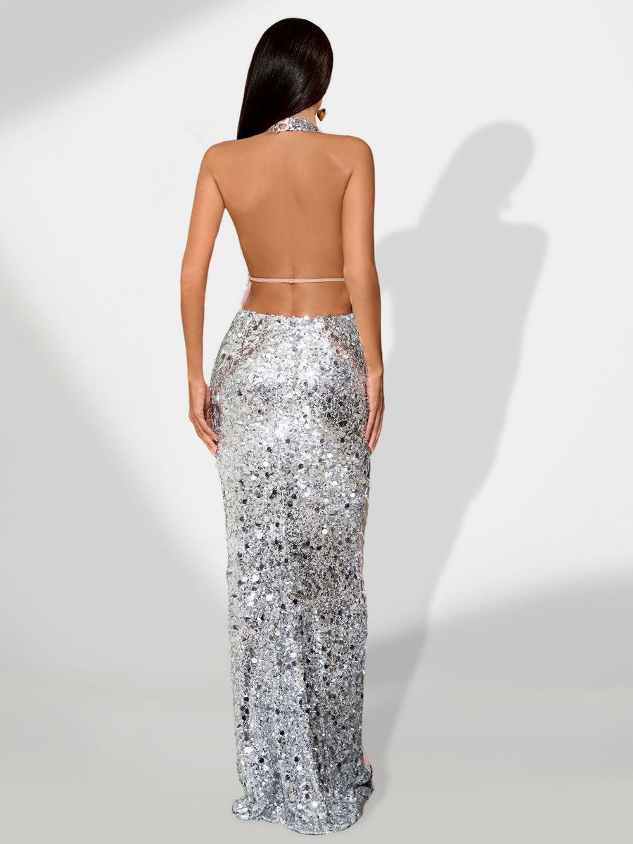 Elegant open-decolleté dress adorned with sparkling jewelry chain