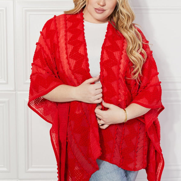 Justin Taylor Pom-Pom Asymmetrical Poncho Cardigan in Red - Opulent EmpireJustin Taylor Pom-Pom Asymmetrical Poncho Cardigan in RedOpulent EmpireClothing