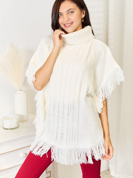 Justin Taylor Turtle Neck Fringe Poncho - Opulent EmpireJustin Taylor Turtle Neck Fringe PonchoOpulent Empire