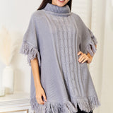 Justin Taylor Turtle Neck Fringe Poncho - Opulent EmpireJustin Taylor Turtle Neck Fringe PonchoOpulent Empire