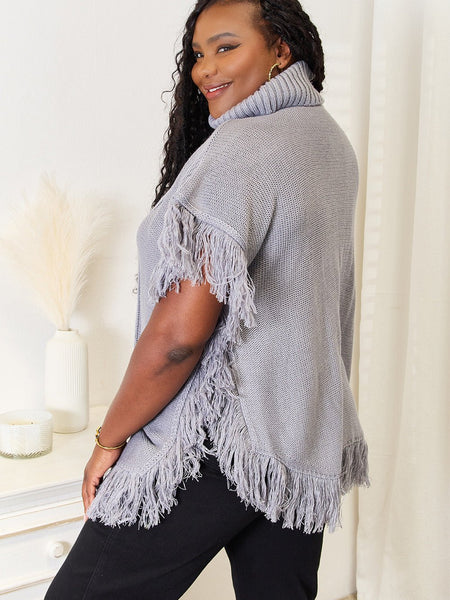 Justin Taylor Turtle Neck Fringe Poncho - Opulent EmpireJustin Taylor Turtle Neck Fringe PonchoOpulent Empire