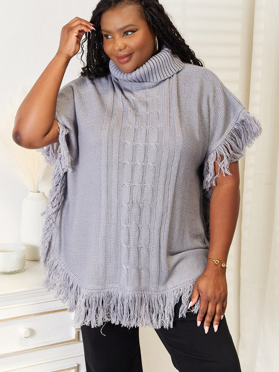 Justin Taylor Turtle Neck Fringe Poncho - Opulent EmpireJustin Taylor Turtle Neck Fringe PonchoOpulent Empire