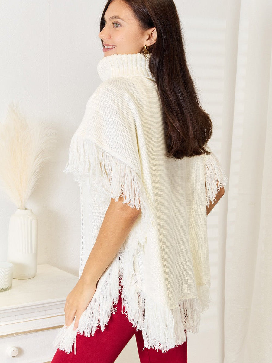 Justin Taylor Turtle Neck Fringe Poncho - Opulent EmpireJustin Taylor Turtle Neck Fringe PonchoOpulent Empire