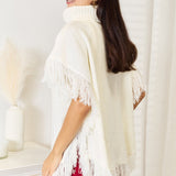 Justin Taylor Turtle Neck Fringe Poncho - Opulent EmpireJustin Taylor Turtle Neck Fringe PonchoOpulent Empire