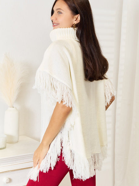 Justin Taylor Turtle Neck Fringe Poncho - Opulent EmpireJustin Taylor Turtle Neck Fringe PonchoOpulent Empire