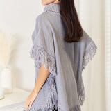 Justin Taylor Turtle Neck Fringe Poncho - Opulent EmpireJustin Taylor Turtle Neck Fringe PonchoOpulent Empire