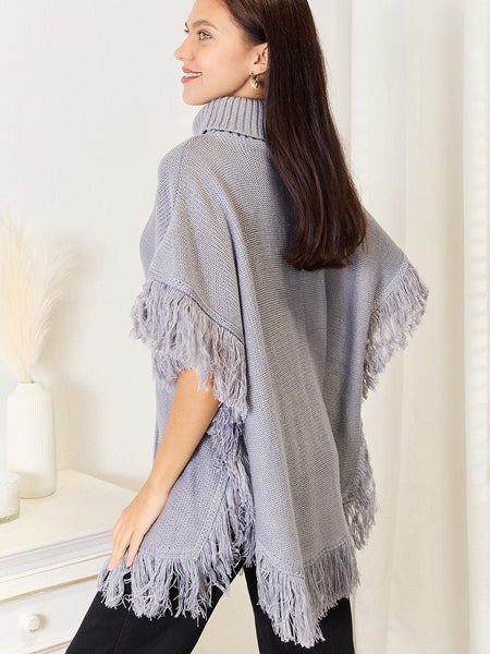 Justin Taylor Turtle Neck Fringe Poncho - Opulent EmpireJustin Taylor Turtle Neck Fringe PonchoOpulent Empire