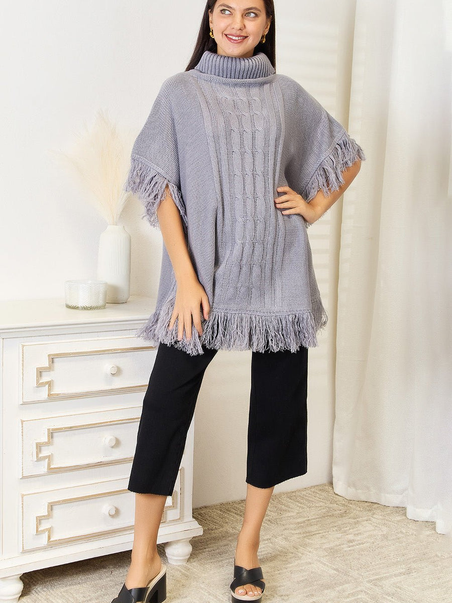 Justin Taylor Turtle Neck Fringe Poncho - Opulent EmpireJustin Taylor Turtle Neck Fringe PonchoOpulent Empire