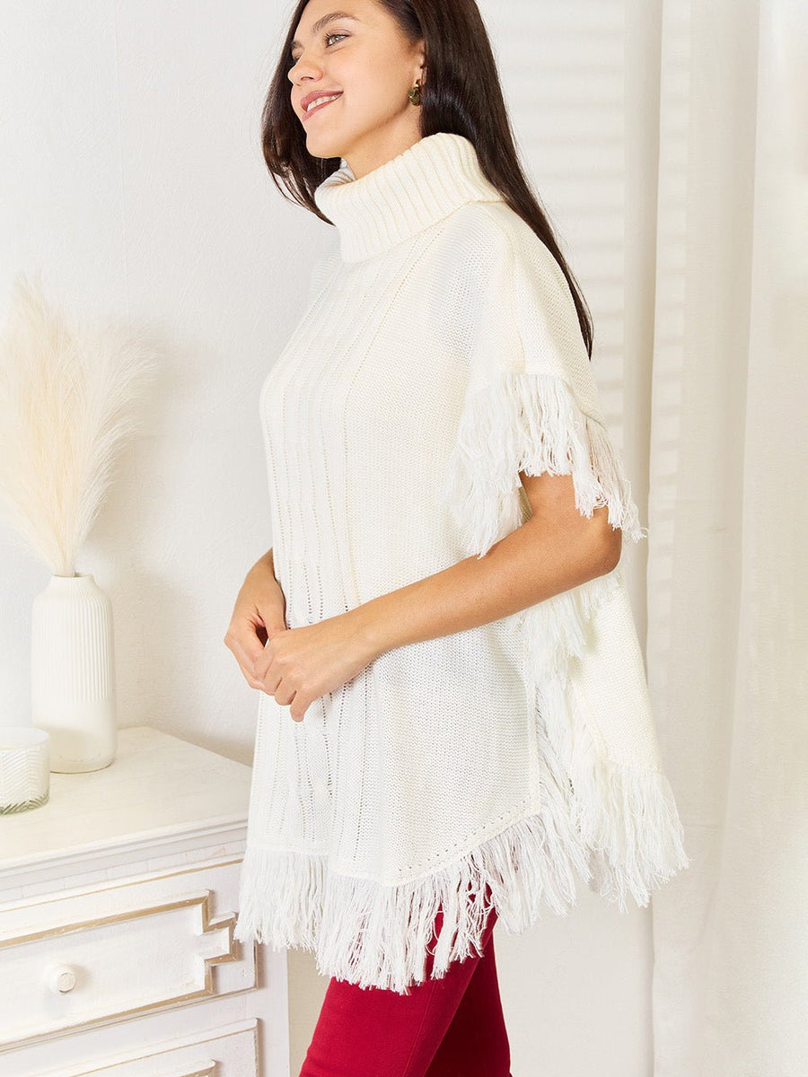 Justin Taylor Turtle Neck Fringe Poncho - Opulent EmpireJustin Taylor Turtle Neck Fringe PonchoOpulent Empire