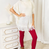 Justin Taylor Turtle Neck Fringe Poncho - Opulent EmpireJustin Taylor Turtle Neck Fringe PonchoOpulent Empire