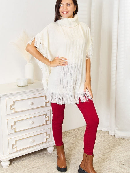 Justin Taylor Turtle Neck Fringe Poncho - Opulent EmpireJustin Taylor Turtle Neck Fringe PonchoOpulent Empire