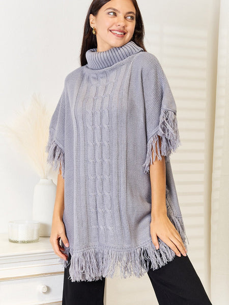 Justin Taylor Turtle Neck Fringe Poncho - Opulent EmpireJustin Taylor Turtle Neck Fringe PonchoOpulent Empire