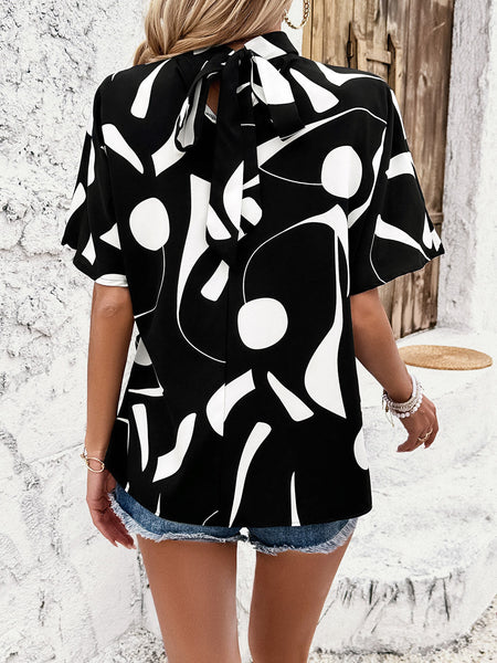 Tied Printed Mock Neck Half Sleeve Blouse - Opulent EmpireTied Printed Mock Neck Half Sleeve BlouseOpulent Empire