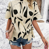 Tied Printed Mock Neck Half Sleeve Blouse - Opulent EmpireTied Printed Mock Neck Half Sleeve BlouseOpulent Empire