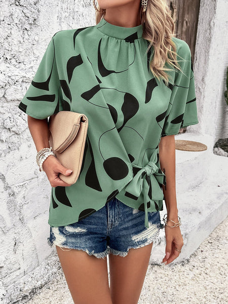 Tied Printed Mock Neck Half Sleeve Blouse - Opulent EmpireTied Printed Mock Neck Half Sleeve BlouseOpulent Empire